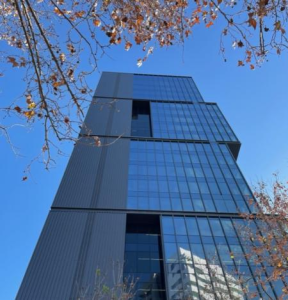 Perforated aluminum and photovoltaic glass facade