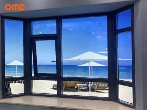 Deep blue aluminum window featuring a modern and minimalist design with a sophisticated and bold color that complements various architectural styles. The window frame has smooth lines, combining durability with a stylish aesthetic.