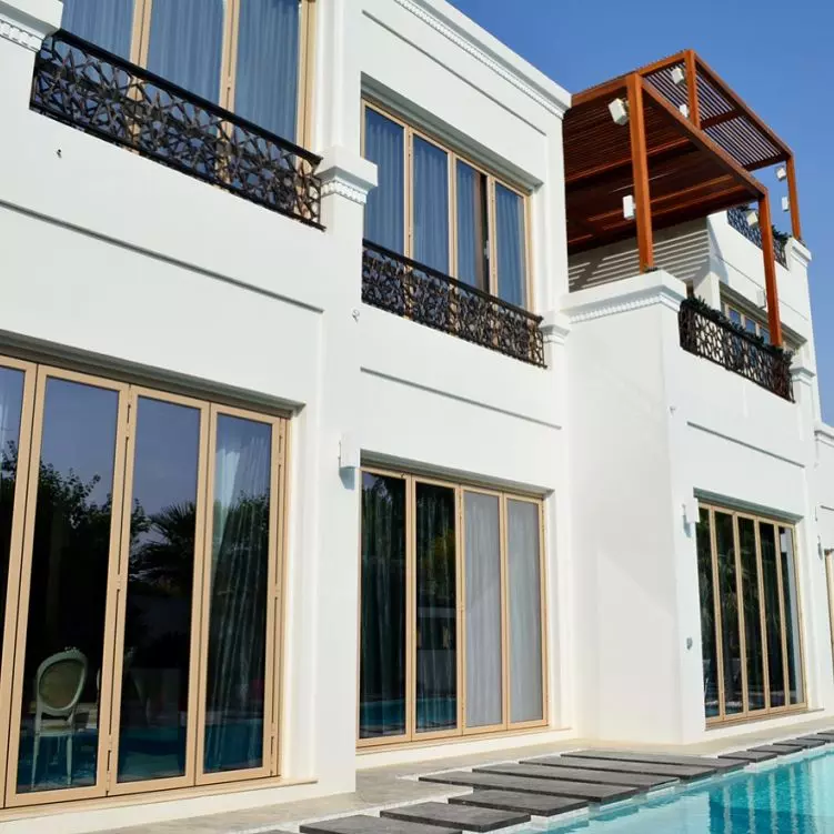 Aluminum doors installed in Dubai villa project with optimized frame design to reduce material use